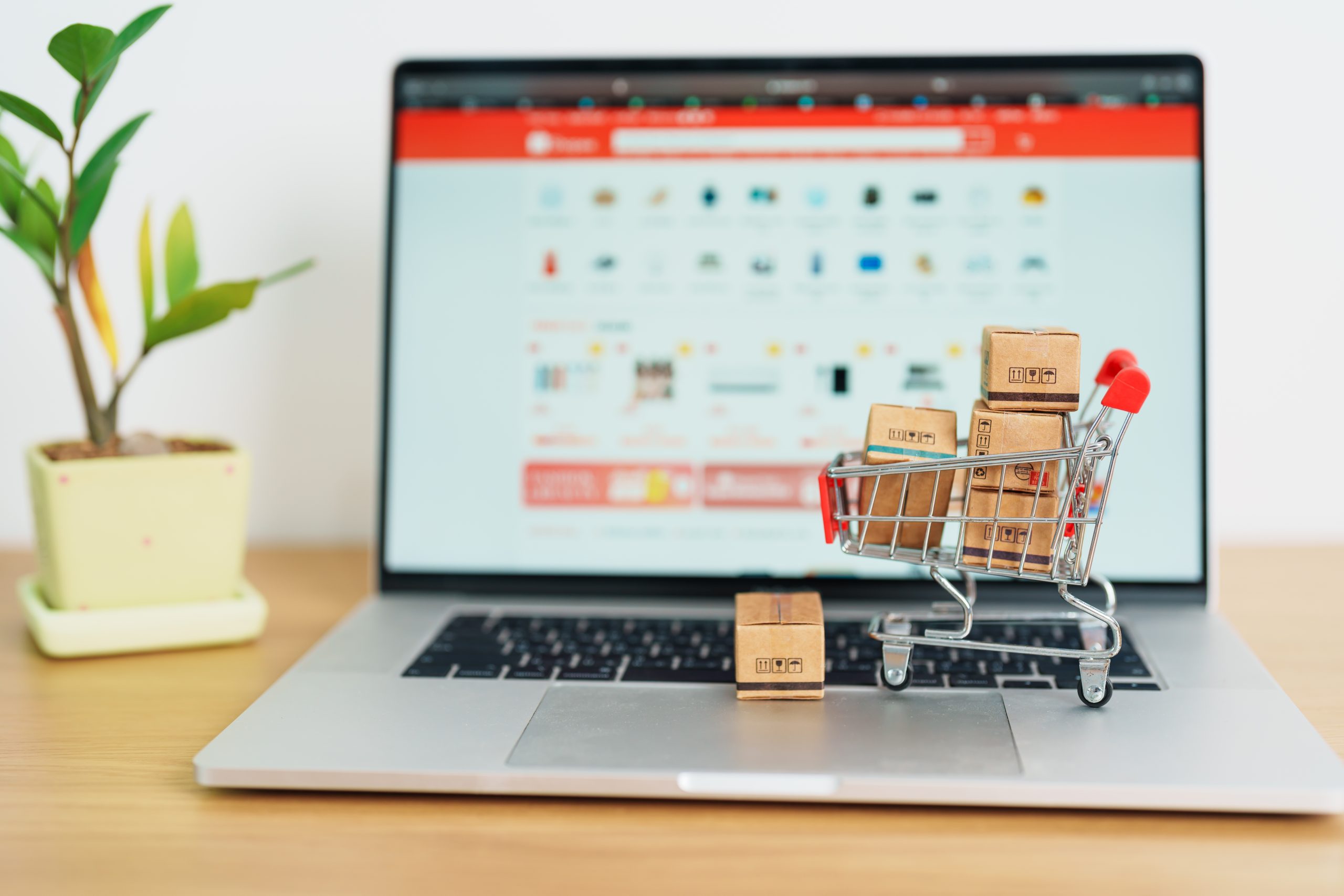 Boxes with shopping cart on a laptop computer. online shopping,